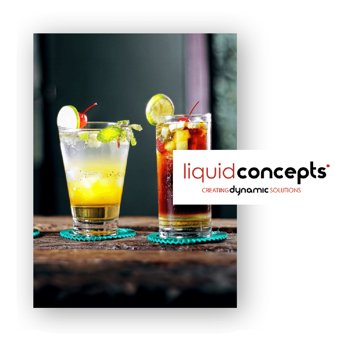 Two refreshing cocktails on a wooden table, one with a yellow citrus mix garnished with lime and mint, the other a dark iced drink garnished with lime and cherry, both served in clear glasses on teal coasters. Liquid Concepts logo with the tagline 'Creating Dynamic Solutions' is displayed.